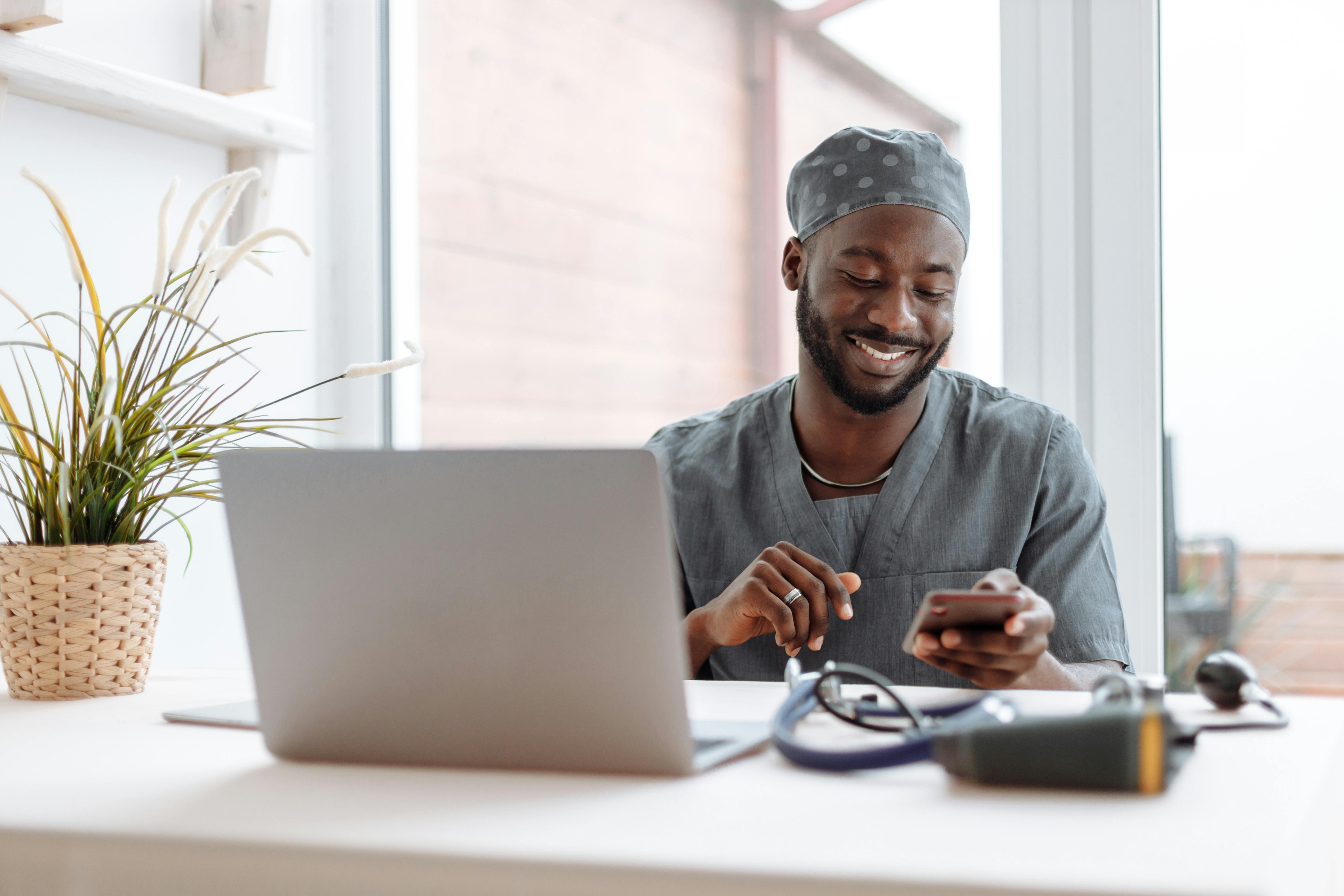 Nurse using HIPAA compliant file sharing to send and access files on their mobile device